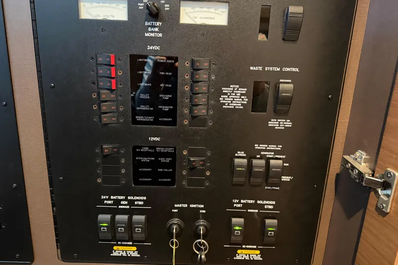  Yacht Photos Pics Control panel of a 2014 Sea Ray 540 Sundancer yacht, featuring various switches and gauges.
