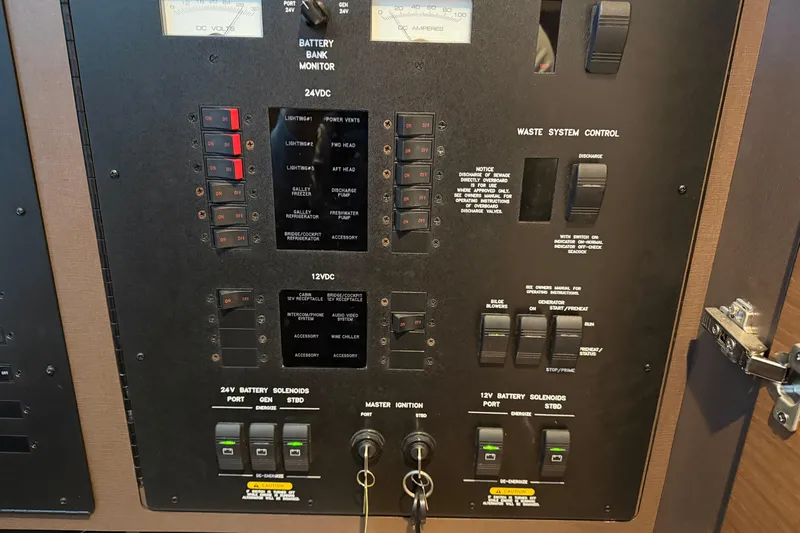  Yacht Photos Pics Control panel of a 2014 Sea Ray 540 Sundancer yacht, featuring battery and waste system controls.