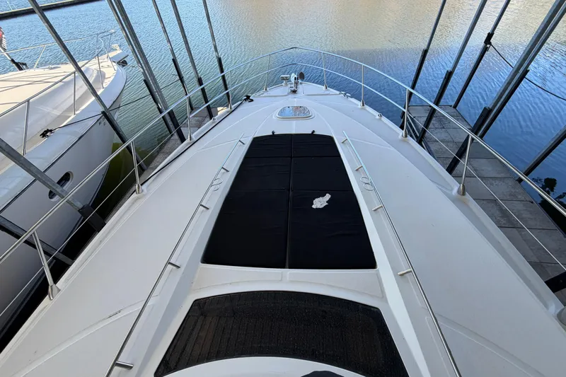  Yacht Photos Pics 2014 Sea Ray 540 Sundancer yacht docked, showcasing sleek deck design and water view.