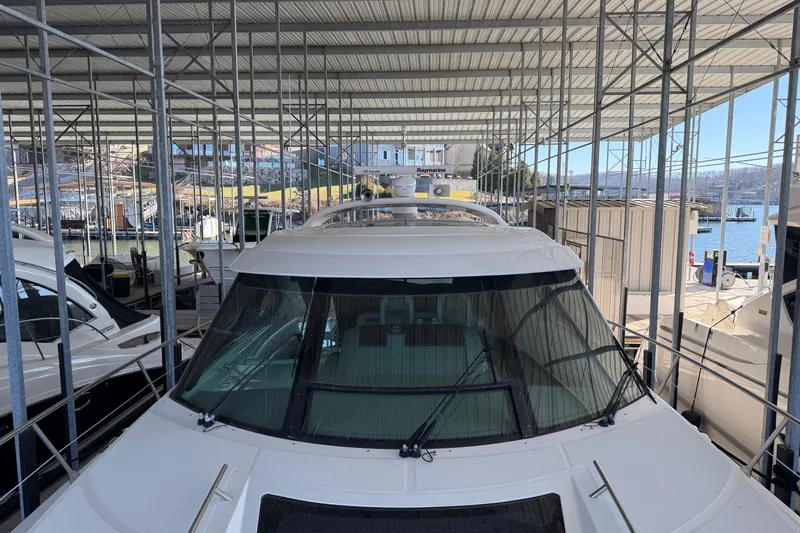  Yacht Photos Pics 2014 Sea Ray 540 Sundancer yacht docked in a covered marina.