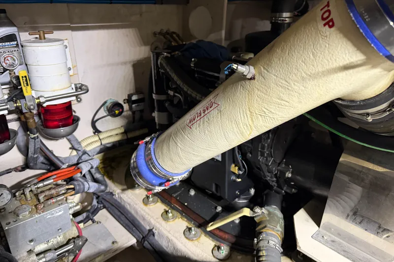  Yacht Photos Pics Engine room of 2014 Sea Ray 540 Sundancer, showcasing mechanical components and piping.