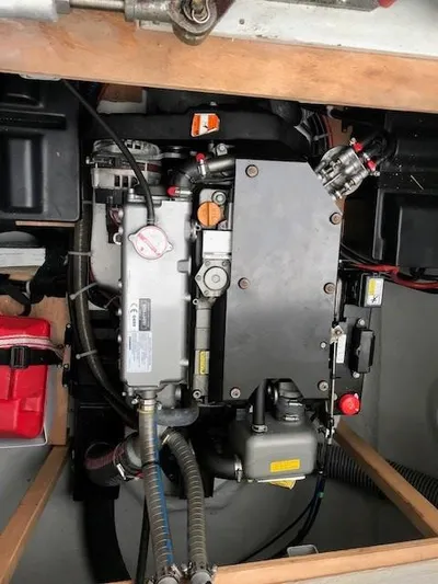 Petalida Yacht Photos Pics Engine compartment of a 2017 Lagoon 42 catamaran, showcasing mechanical components and wiring.