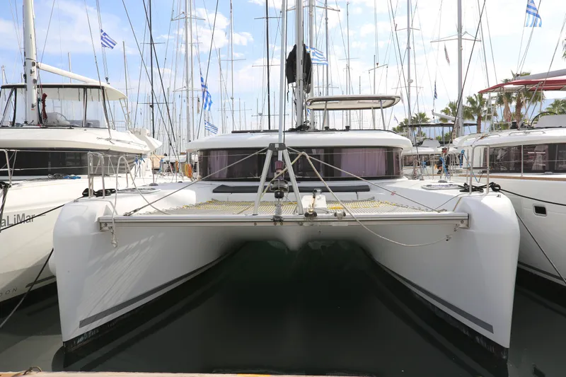 Petalida Yacht Photos Pics 2017 Lagoon 42 catamaran docked at marina, surrounded by other boats.
