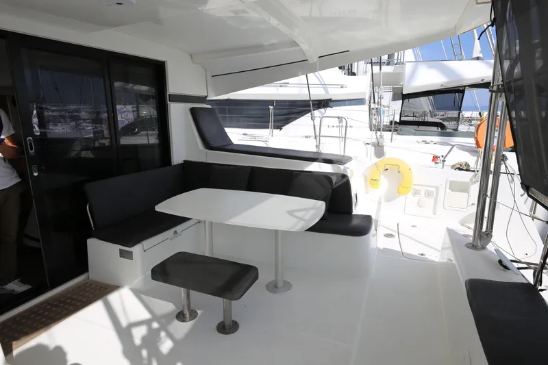 Petalida Yacht Photos Pics 2017 Lagoon 42 yacht cockpit with seating, table, and modern design.