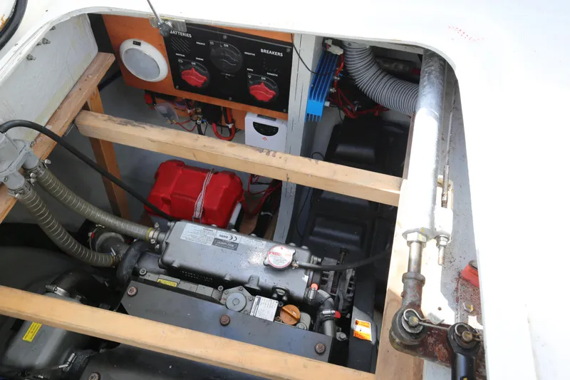 Petalida Yacht Photos Pics Engine compartment of a 2017 Lagoon 42 catamaran, showcasing mechanical components and control panels.