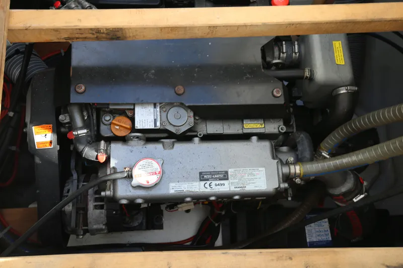 Petalida Yacht Photos Pics Engine compartment of a 2017 Lagoon 42 catamaran, showcasing mechanical components and hoses.