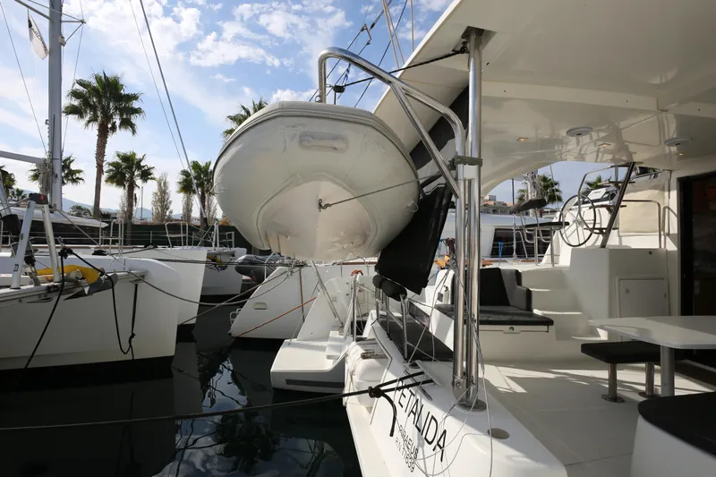 Petalida Yacht Photos Pics 2017 Lagoon 42 catamaran docked, featuring spacious deck and modern design.