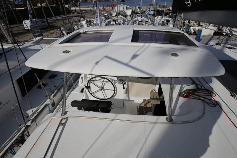 Petalida Yacht Photos Pics 2017 Lagoon 42 catamaran helm station with dual steering wheels and navigation equipment.