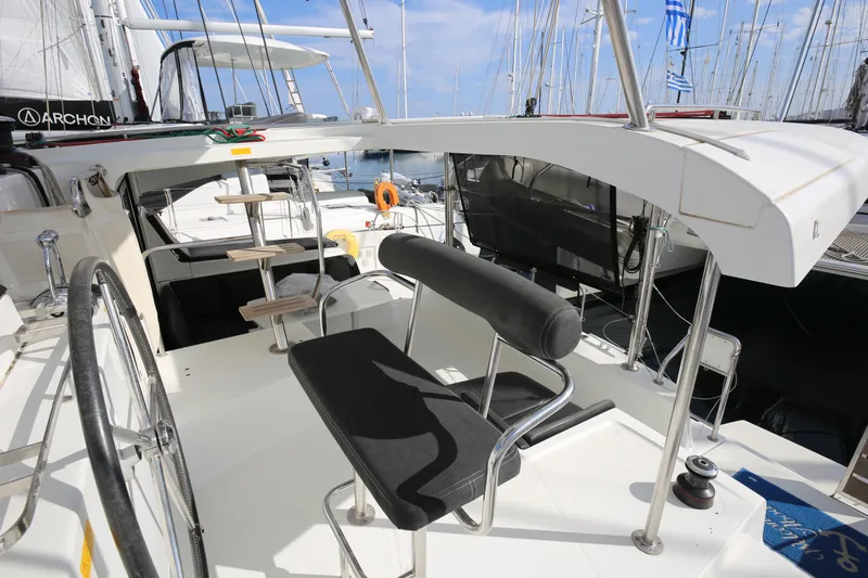 Petalida Yacht Photos Pics Cockpit of 2017 Lagoon 42 catamaran with steering wheel and seating.
