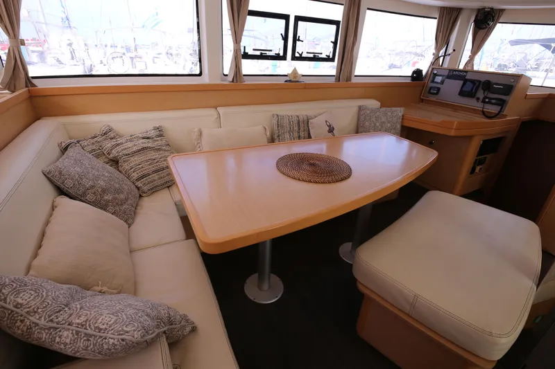 Petalida Yacht Photos Pics Interior of 2017 Lagoon 42 catamaran with cozy seating and dining area.