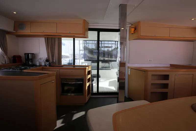 Petalida Yacht Photos Pics Interior of 2017 Lagoon 42 catamaran, featuring modern kitchen and dining area.