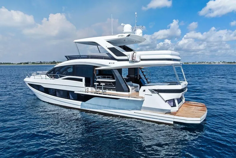 Triple T Yacht Photos Pics 2022 Galeon 640 Fly yacht on open water under a blue sky.