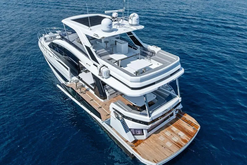 Triple T Yacht Photos Pics Luxury 2022 Galeon 640 Fly yacht cruising on open sea.