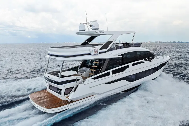 Triple T Yacht Photos Pics 2022 Galeon 640 Fly yacht cruising on open water, showcasing sleek design and luxury features.