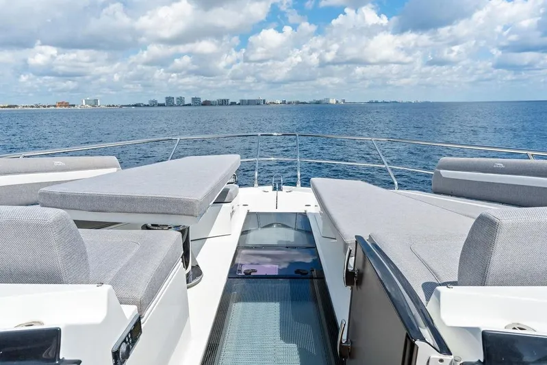 Triple T Yacht Photos Pics Luxurious 2022 Galeon 640 Fly yacht deck with ocean view and city skyline.