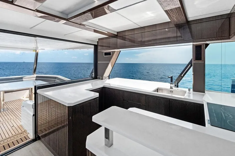 Triple T Yacht Photos Pics Luxurious interior of 2022 Galeon 640 Fly yacht with ocean view.