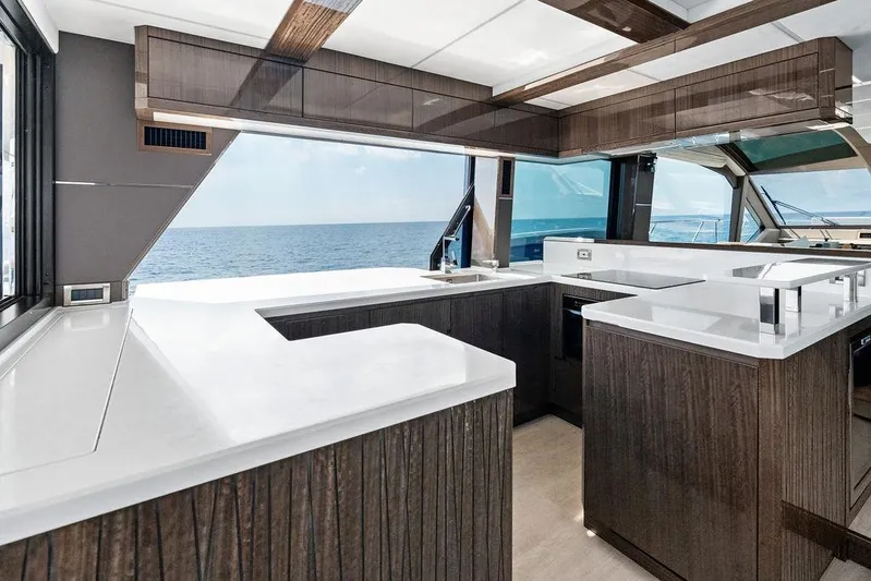 Triple T Yacht Photos Pics Luxurious kitchen interior of 2022 Galeon 640 Fly yacht with ocean view.
