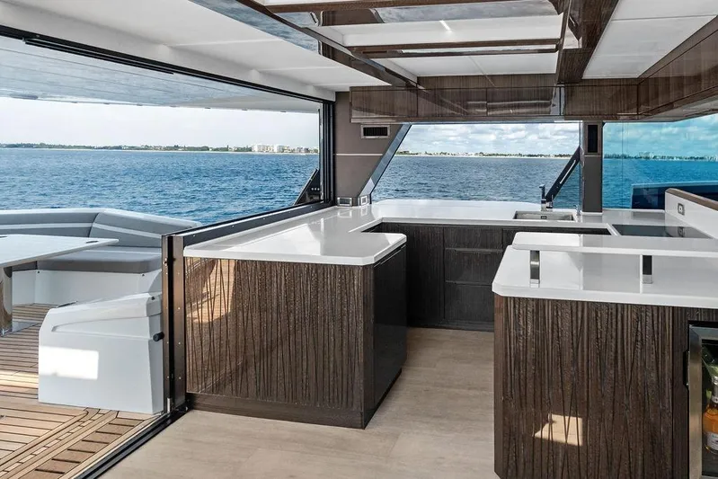 Triple T Yacht Photos Pics Luxurious 2022 Galeon 640 Fly yacht interior with modern kitchen and ocean view.