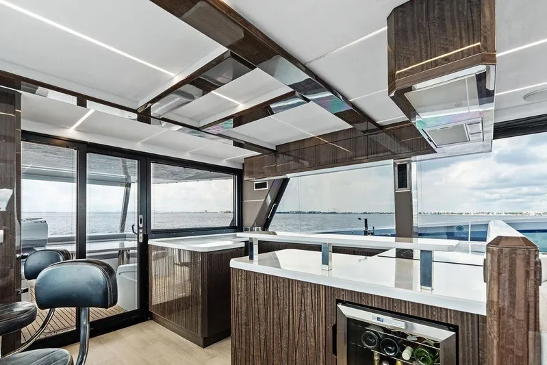 Triple T Yacht Photos Pics Luxurious interior of 2022 Galeon 640 Fly yacht with modern design and ocean view.