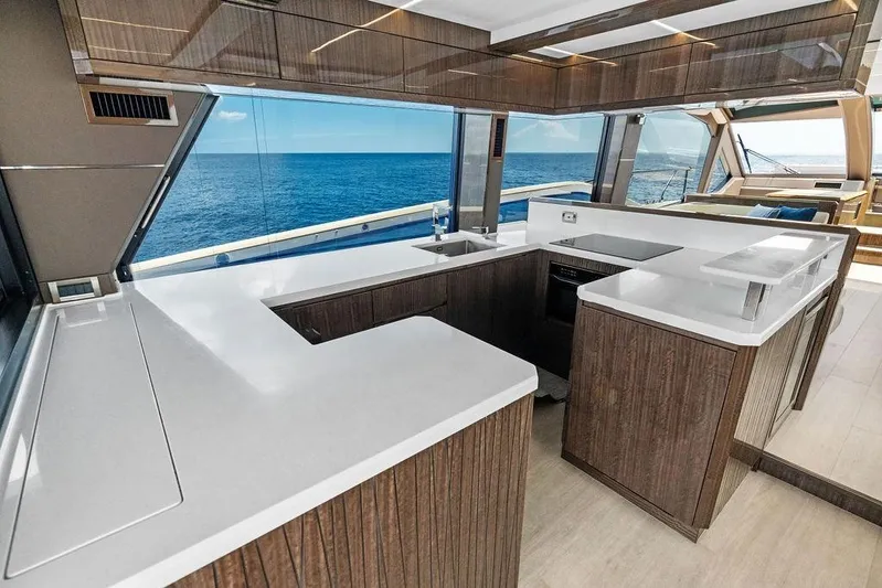 Triple T Yacht Photos Pics Luxurious kitchen interior of 2022 Galeon 640 Fly yacht with ocean view.