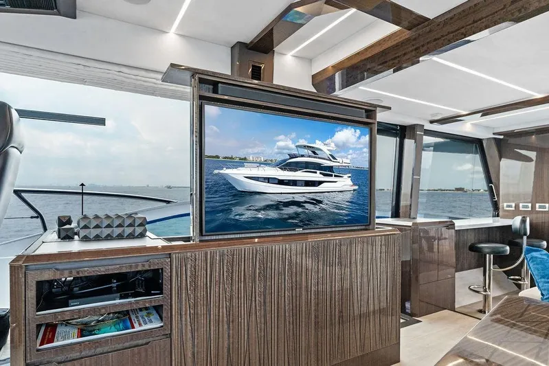 Triple T Yacht Photos Pics Luxurious interior of 2022 Galeon 640 Fly yacht with modern design and sea view.