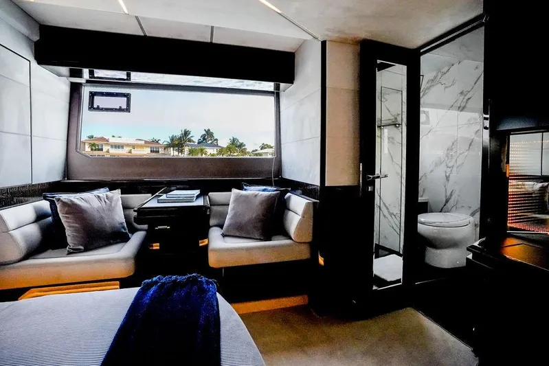 Triple T Yacht Photos Pics Luxurious interior of 2022 Galeon 640 Fly yacht with modern seating and elegant bathroom.