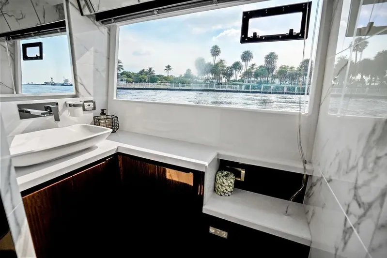 Triple T Yacht Photos Pics Luxurious bathroom interior of 2022 Galeon 640 Fly yacht with ocean view.