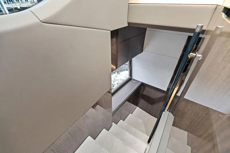 Triple T Yacht Photos Pics Staircase inside 2022 Galeon 640 Fly yacht, featuring modern design and sleek finishes.