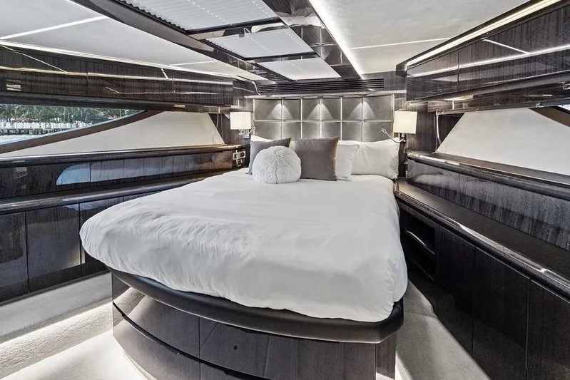 Triple T Yacht Photos Pics Luxurious bedroom interior of 2022 Galeon 640 Fly yacht with modern design and elegant furnishings.