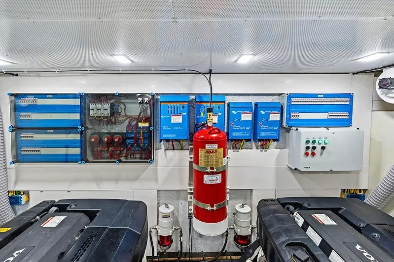 Triple T Yacht Photos Pics Engine room of 2022 Galeon 640 Fly yacht with electrical panels and fire extinguisher.