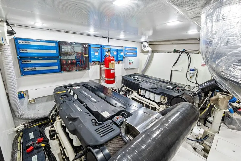 Triple T Yacht Photos Pics Engine room of 2022 Galeon 640 Fly yacht, featuring advanced machinery and control panels.
