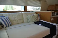 Luxurious interior of 2007 Cabo 43 FB yacht with comfortable seating and stylish decor.