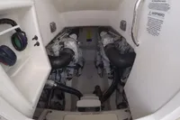 Engine room of a 2007 Cabo 43 FB boat, featuring dual engines and safety instructions.