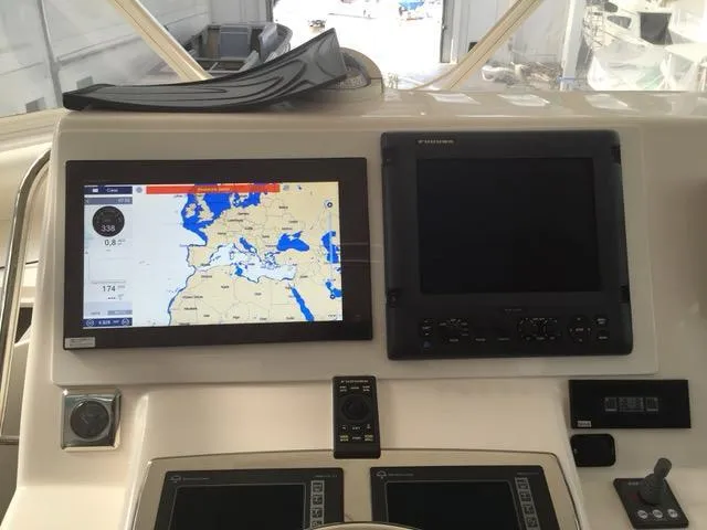 Cabo 43fb Yacht Photos Pics Navigation system on 2007 Cabo 43 FB yacht dashboard with map display.