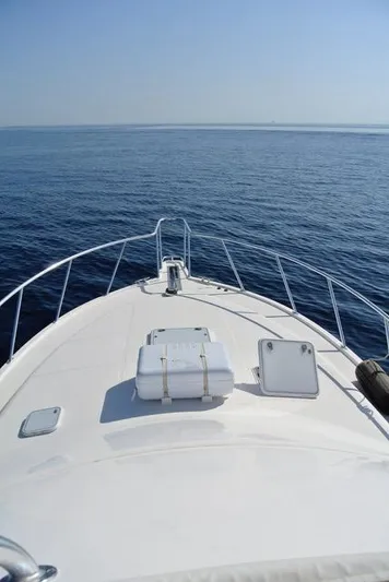 Cabo 43fb Yacht Photos Pics 2007 Cabo 43 FB yacht bow view on calm ocean waters.