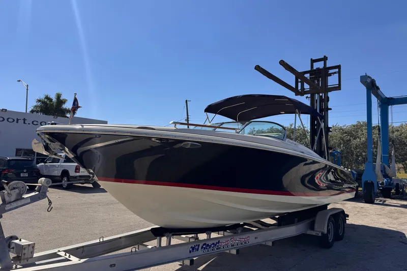 Yacht Photos Pics 2019 Chris-Craft Corsair 30 boat on trailer under clear blue sky.