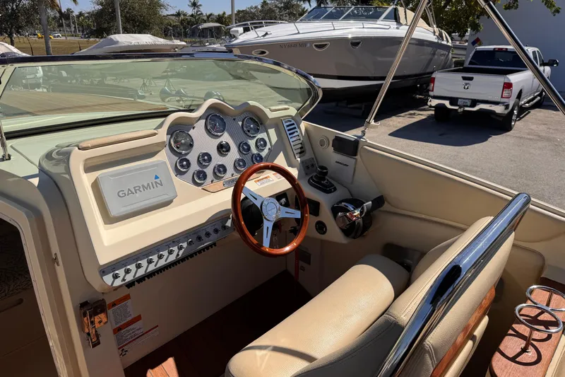  Yacht Photos Pics 2019 Chris-Craft Corsair 30 boat dashboard with Garmin navigation system and leather seating.