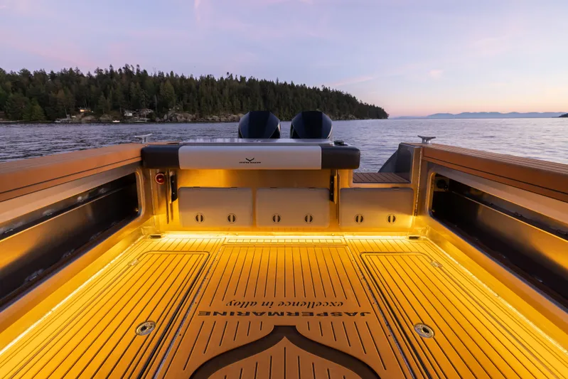 Jasper Marine Defender 22 Yacht Photos Pics 2025 Jasper Marine Defender 22 boat deck at sunset, featuring sleek design and ambient lighting.