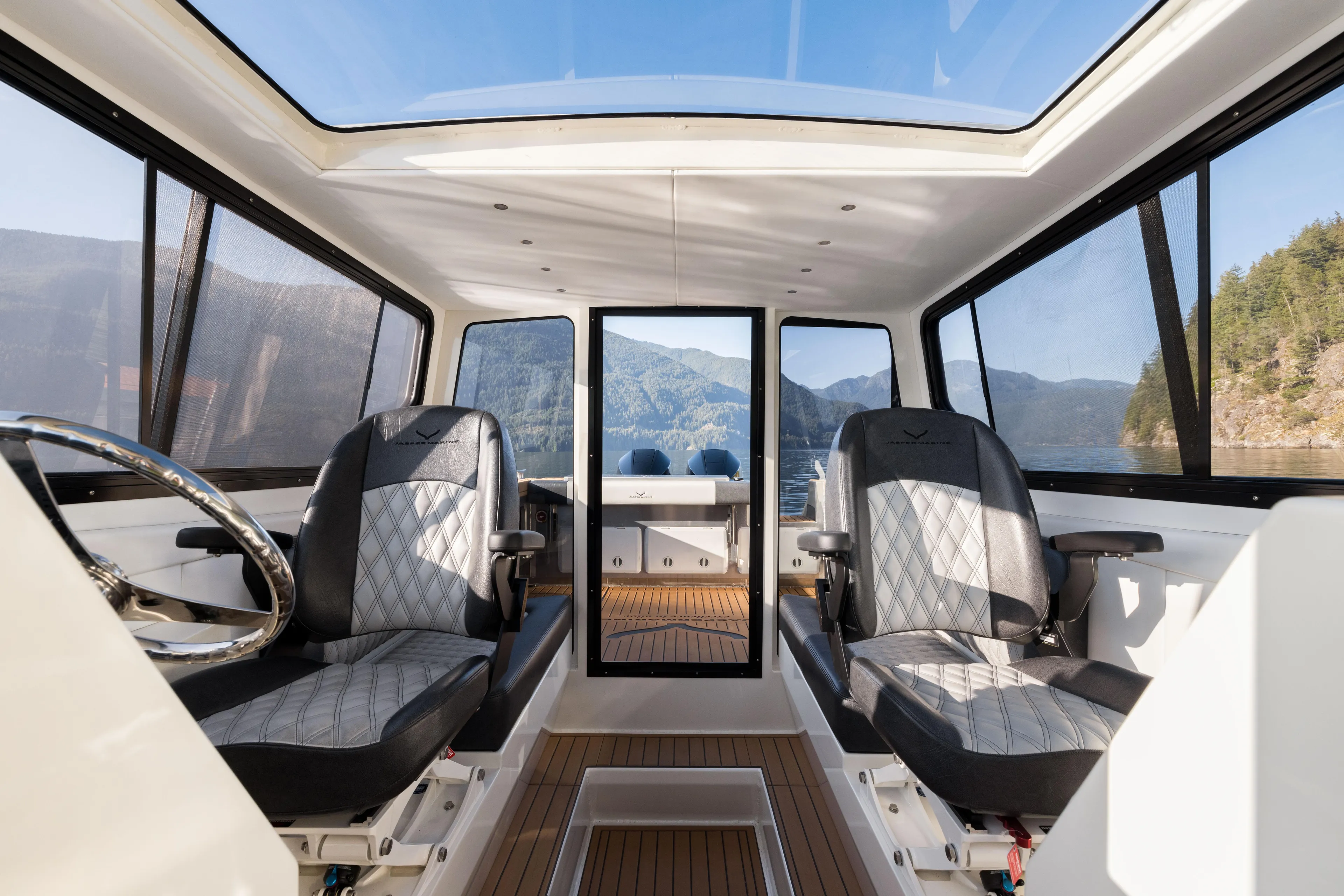 Jasper Marine Defender 22 Yacht Photos Pics Interior of 2025 Jasper Marine Defender 22 boat with panoramic windows and modern seating.