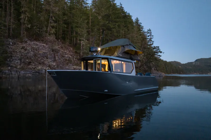 Jasper Marine Defender 22 Yacht Photos Pics 2025 Jasper Marine Defender 22 - Storm Bow on tranquil water at dusk.