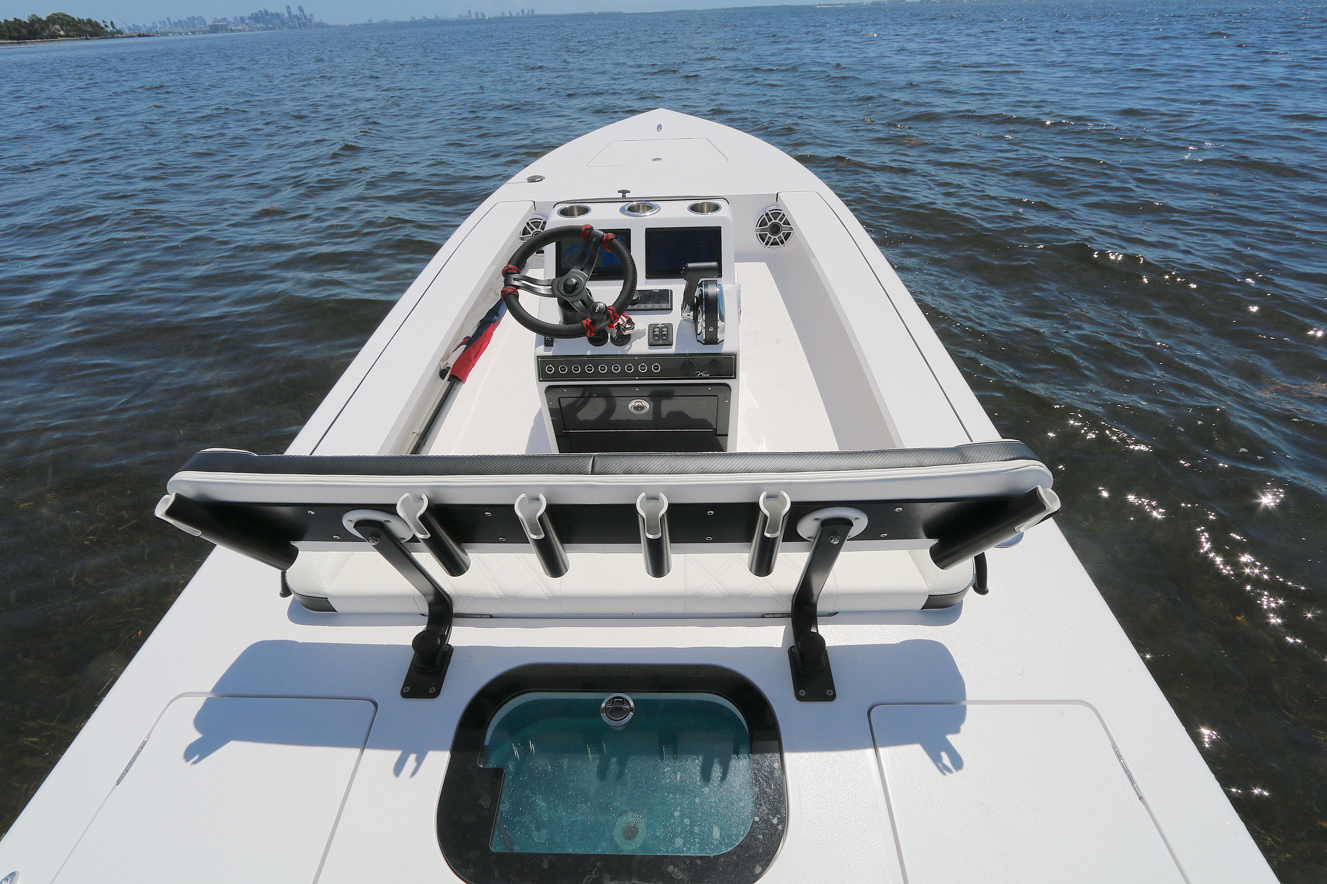 2024 Vtech 18 boat interior with steering wheel and rod holders on open water.