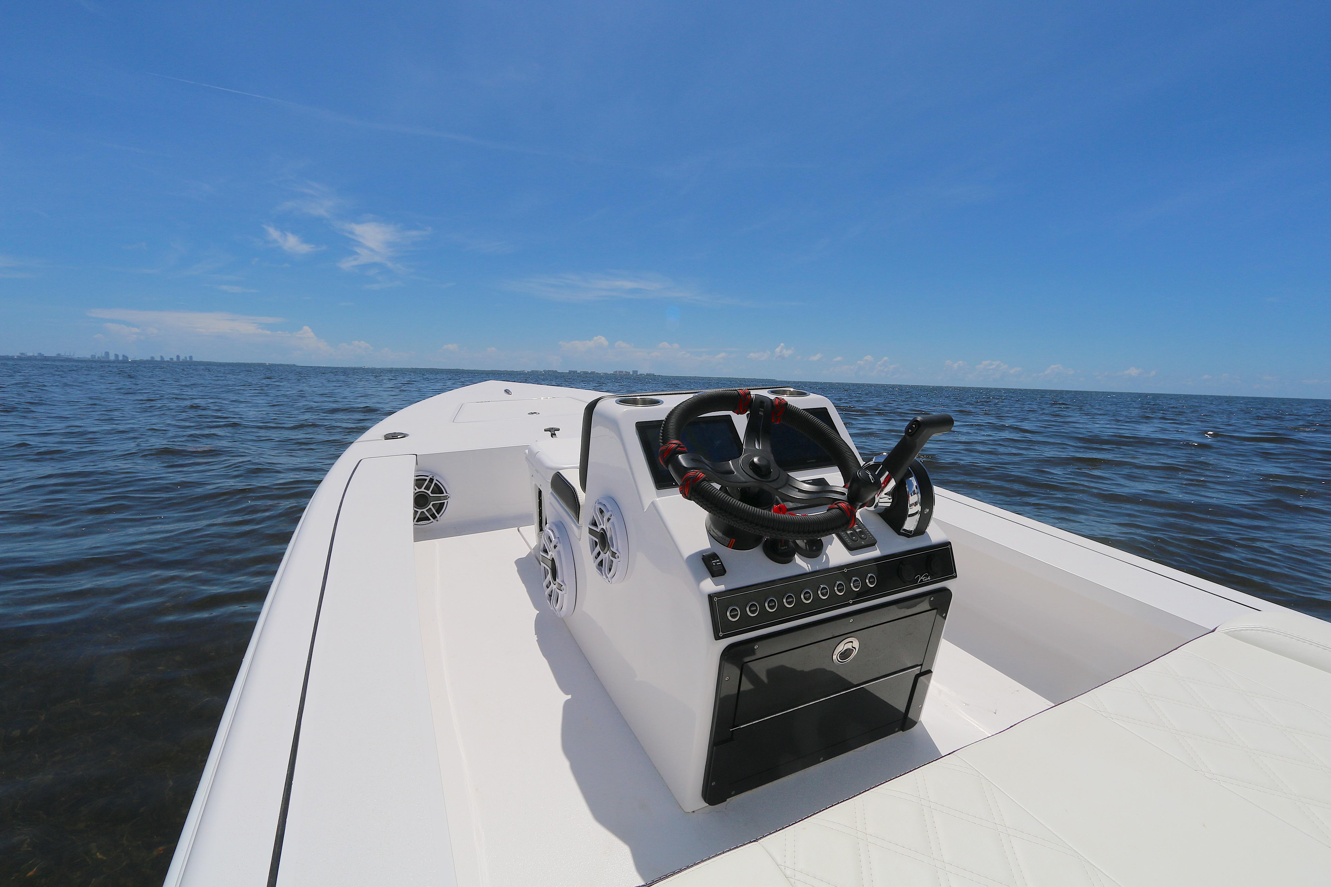 2024 Vtech 18 boat on open water under clear blue sky.