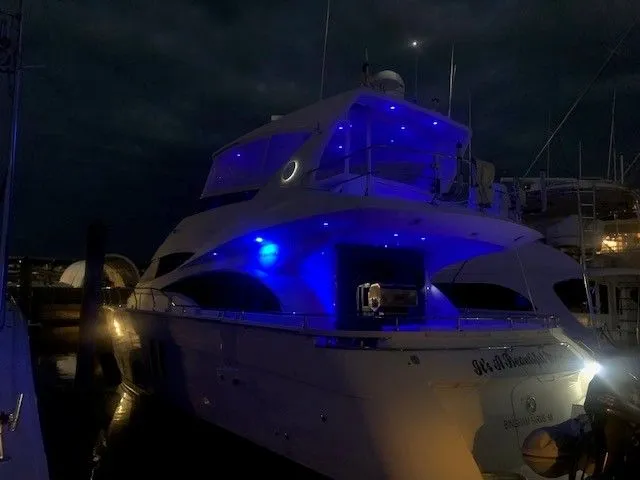 It's A Beautiful Morning Yacht Photos Pics Luxurious 2007 Marquis Markham Edition yacht illuminated with blue lights at night.