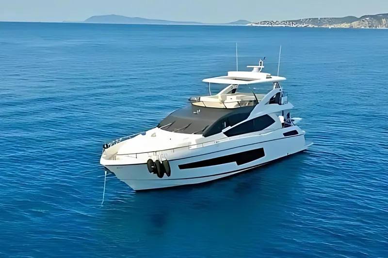 Sarahlisa Yacht Photos Pics Luxurious 2015 Sunseeker 75 yacht cruising on clear blue waters.