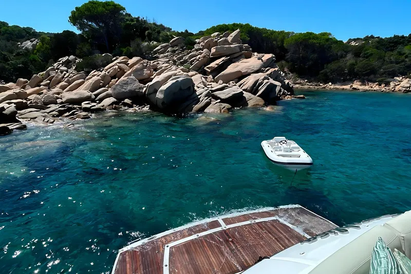 Sarahlisa Yacht Photos Pics Luxury Sunseeker 75 yacht near rocky coastline with clear blue water, 2015 model.