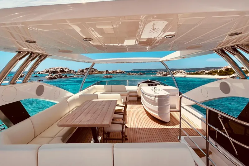 Sarahlisa Yacht Photos Pics Luxurious 2015 Sunseeker 75 yacht interior with ocean view, featuring elegant seating and dining area.