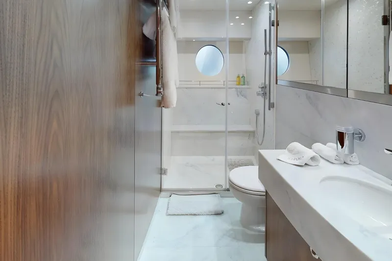 Sarahlisa Yacht Photos Pics Luxurious bathroom in a 2015 Sunseeker 75 yacht, featuring modern fixtures and elegant design.
