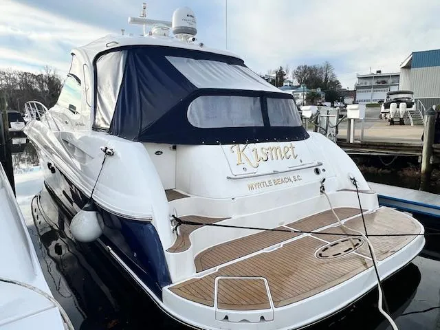  Yacht Photos Pics 2005 Sea Ray 500 Sundancer yacht docked, featuring a sleek design and wooden deck.