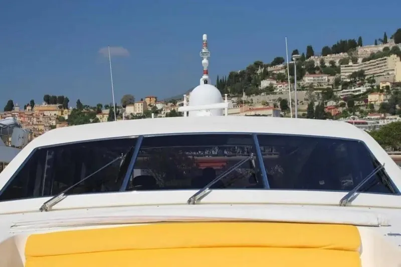  Yacht Photos Pics Luxury yacht Cantieri dell'Arno Leopard 27 open, 2000 model, docked with scenic hillside backdrop.