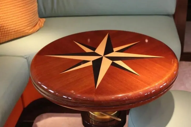  Yacht Photos Pics Luxurious wooden table with star design on Leopard 27 open yacht, 2000 model.